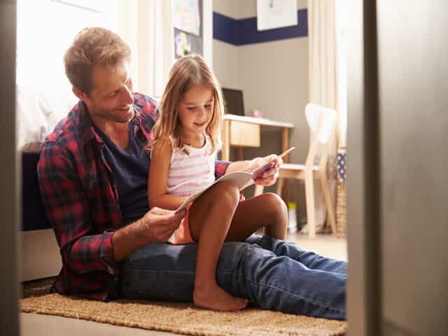 Father reading to daughter representing child custody 