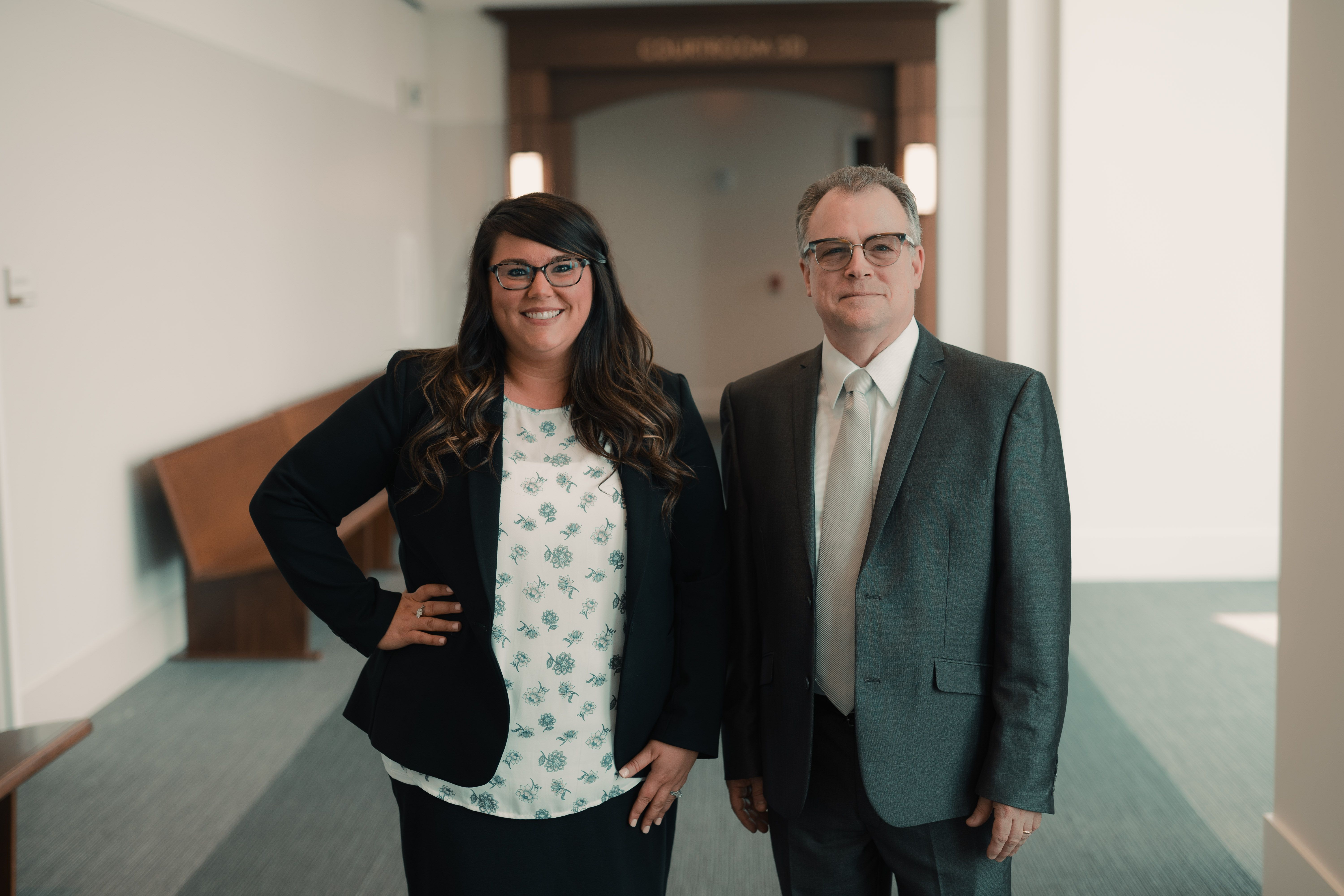 Attorneys Abigail L. Burnham and Mithcell E. Shannon standing and posing for the photo 